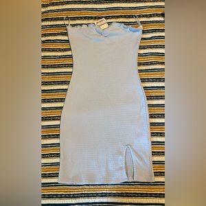 Brand new baby blue mini dress with slit in the bottom front.